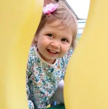 a girl smiling to camera